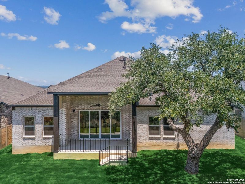 Front exterior of a new home in The Grove at Vintage Oaks, New Braunfels, TX, highlighting curb appeal (Image 17).