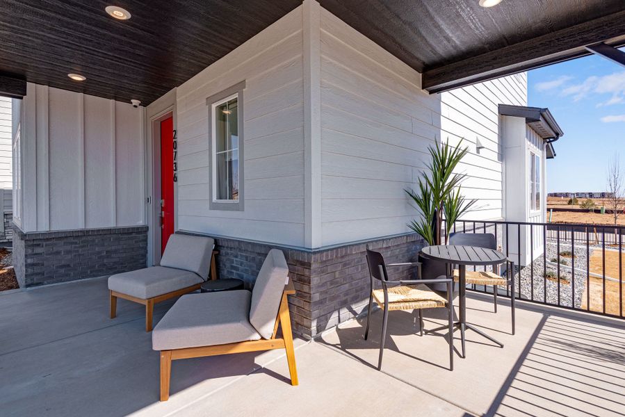 Exterior details and patio area of a home in Painted Prairie, Aurora (Image 23).