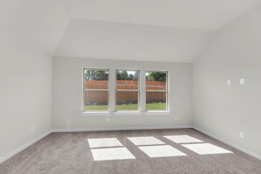 Primary Bedroom in the Pecos home plan by Trophy Signature Homes – REPRESENTATIVE PHOTO