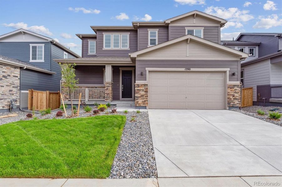 Front exterior of a new home in Floret Collection at Parkdale Commons, Lafayette, CO, highlighting curb appeal (Image 1).