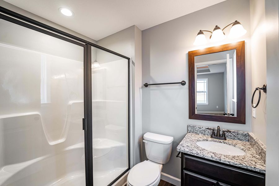 Representative furnished interior of a home built from the Saxon by Enchanted Homes in Guadalupe Heights, Seguin (Image 6).