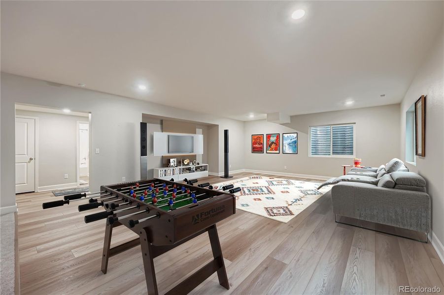 Family/Bonus Room in Finished Basement- Virtually Staged