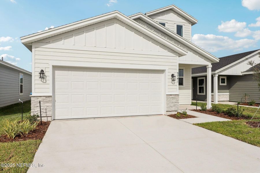 Front exterior of a new home in Cypress Meadows - Classic Series, Jacksonville, FL, highlighting curb appeal (Image 25).