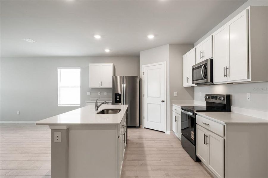 Furnished interior view inside a new home in Coral Lakes - Tradition & Express, Punta Gorda (Image 5). Furnished interior view inside a new home in Coral Lakes - Tradition & Express, Punta Gorda (Image 5).