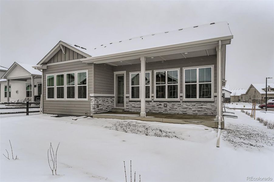 Exterior details and patio area of a home in Hilltop 55+ at Inspiration 55s, Aurora (Image 16).