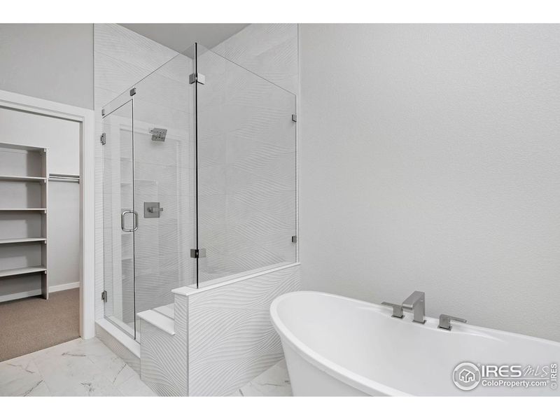 Primary Bathroom with frameless shower & soaking tub