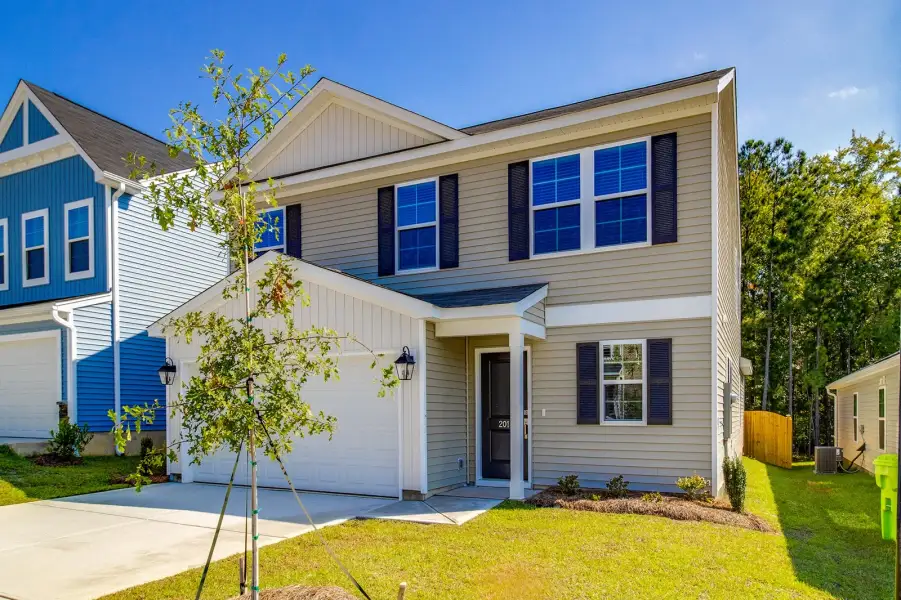 Front exterior of a new home in Killians Crossing, Blythewood, SC, highlighting curb appeal (Image 21). Front exterior of a new home in Killians Crossing, Blythewood, SC, highlighting curb appeal (Image 21).