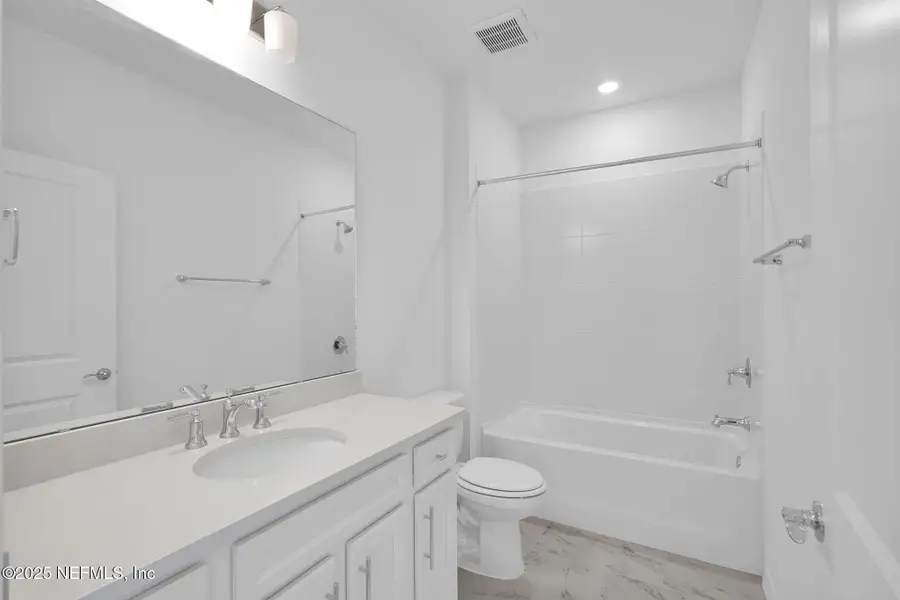 Furnished interior view inside a new home in Summer Bay at Grand Oaks, St. Augustine (Image 7).