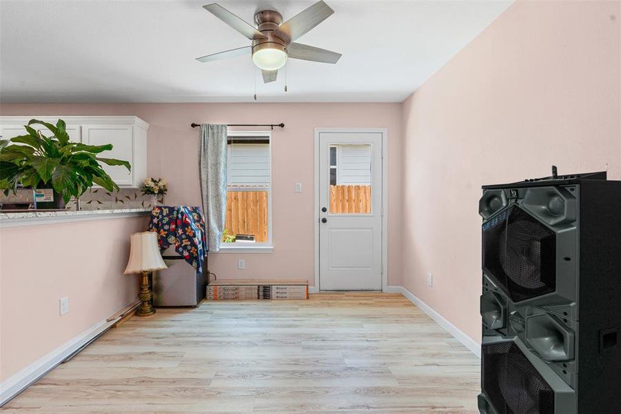 Entrance foyer featuring light wood-style floors and baseboards Entrance foyer featuring light wood-style floors and baseboards