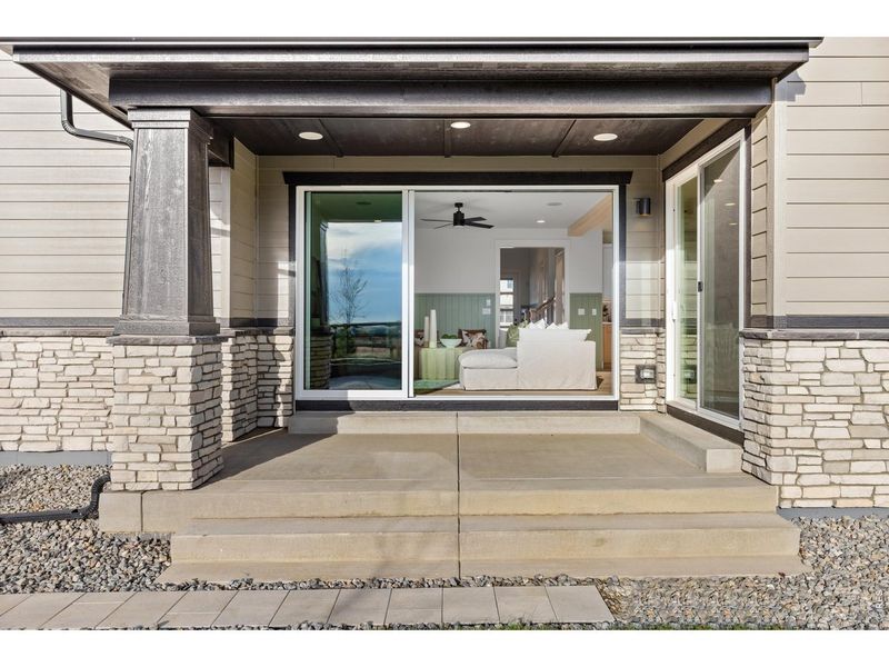 Exterior details and patio area of a home in Barefoot Lakes, Firestone (Image 22).