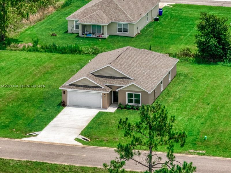 Front exterior of a new home in , Sebring, FL, highlighting curb appeal (Image 2). Front exterior of a new home in , Sebring, FL, highlighting curb appeal (Image 2).