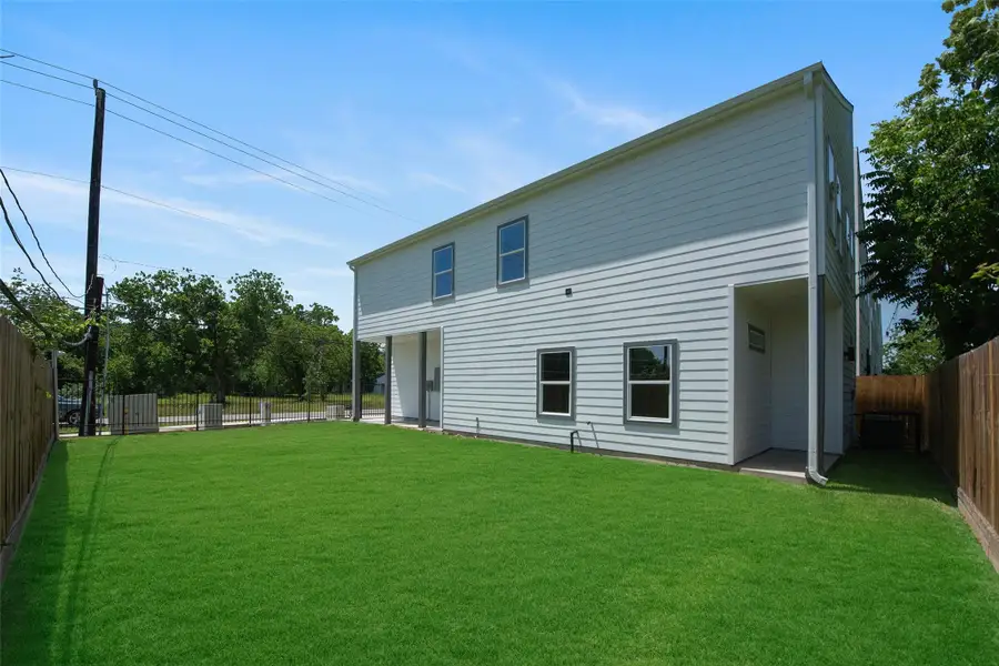 Another view of the large, gated side yard offering privacy and versatile outdoor space for play, pets, and entertaining. Another view of the large, gated side yard offering privacy and versatile outdoor space for play, pets, and entertaining.