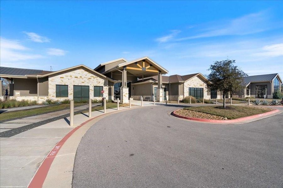 This amenity center, located by the sales office, offers an indoor and outdoor swimming pool, fitness center, and studio space.