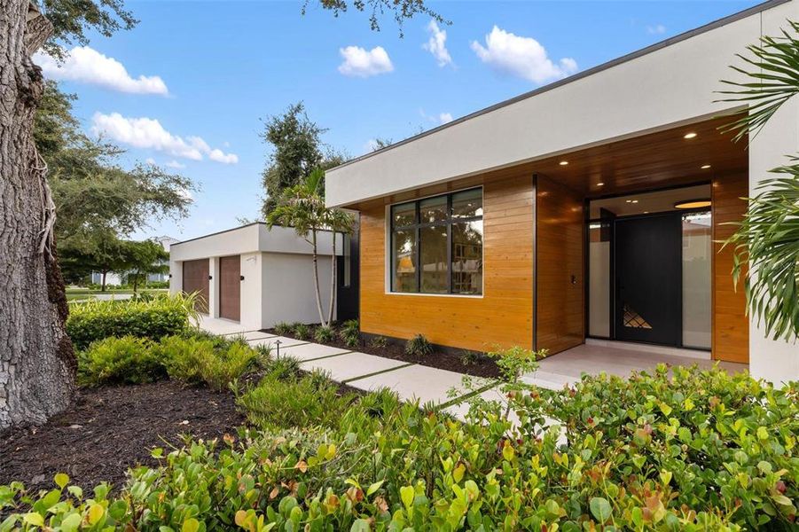 Front exterior of a new home in , Sarasota, FL, highlighting curb appeal (Image 24).