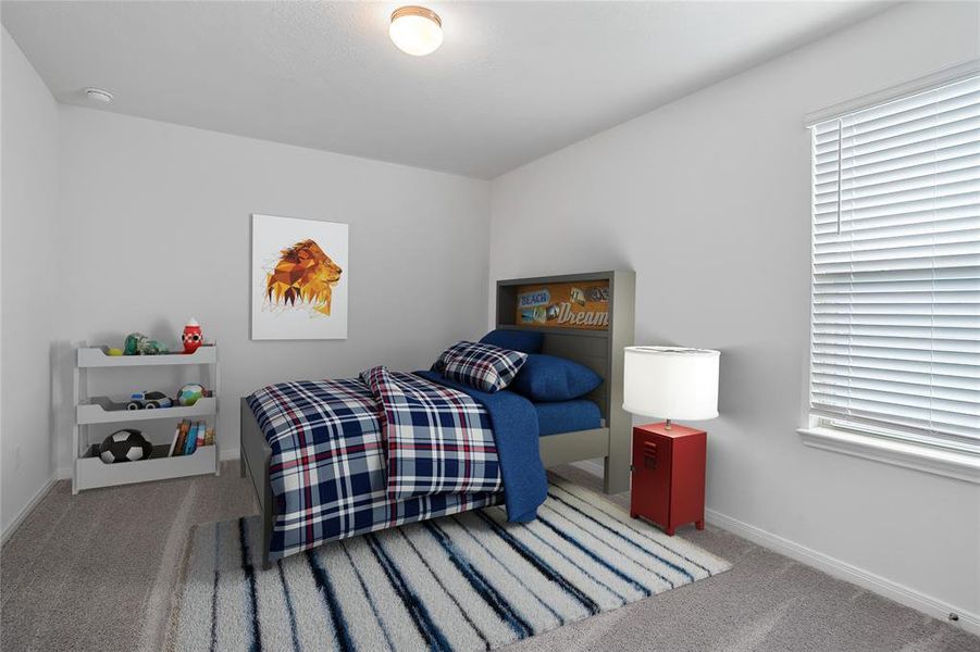 Secondary bedroom features plush carpet, custom paint and a large window.