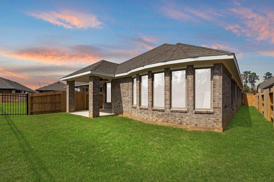 Exterior details and patio area of a home in Grand Central Park, Conroe (Image 3).