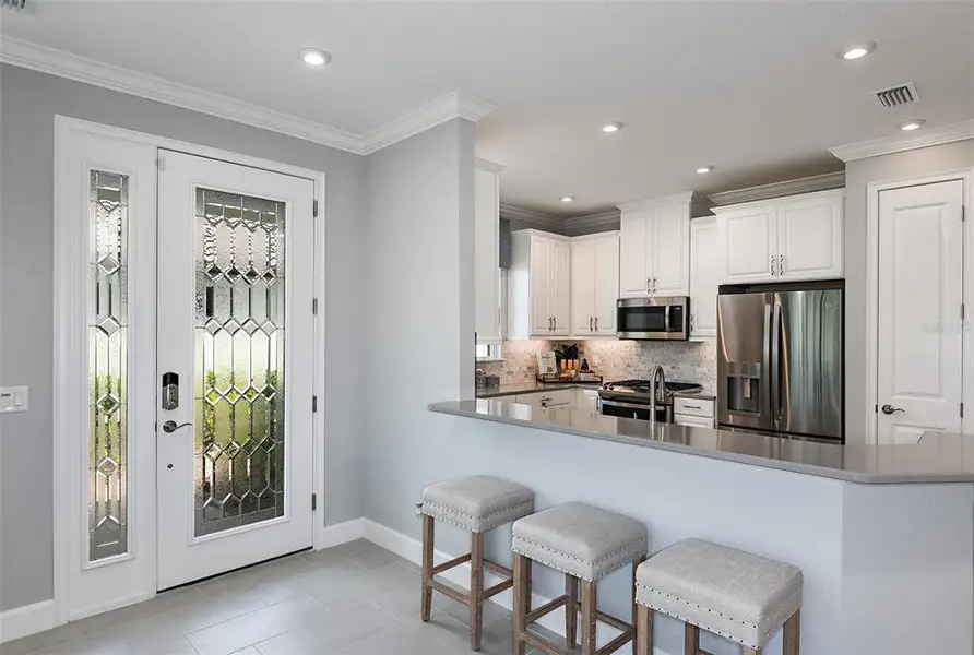 Furnished interior view inside a new home in Esplanade at Wellen Park, Englewood (Image 6).