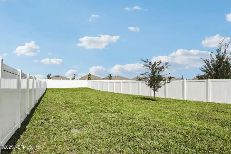 Front exterior of a new home in Cross Creek Express, Green Cove Springs, FL, highlighting curb appeal (Image 24).