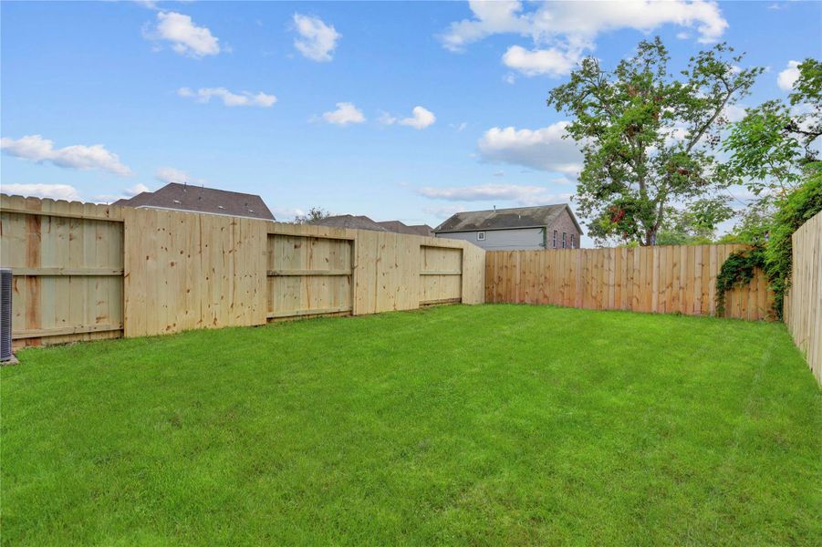 The spacious 24x40 SF back yard has endless possibilities. Excellent sun exposure for fruit trees or gardening! The spacious 24x40 SF back yard has endless possibilities. Excellent sun exposure for fruit trees or gardening!