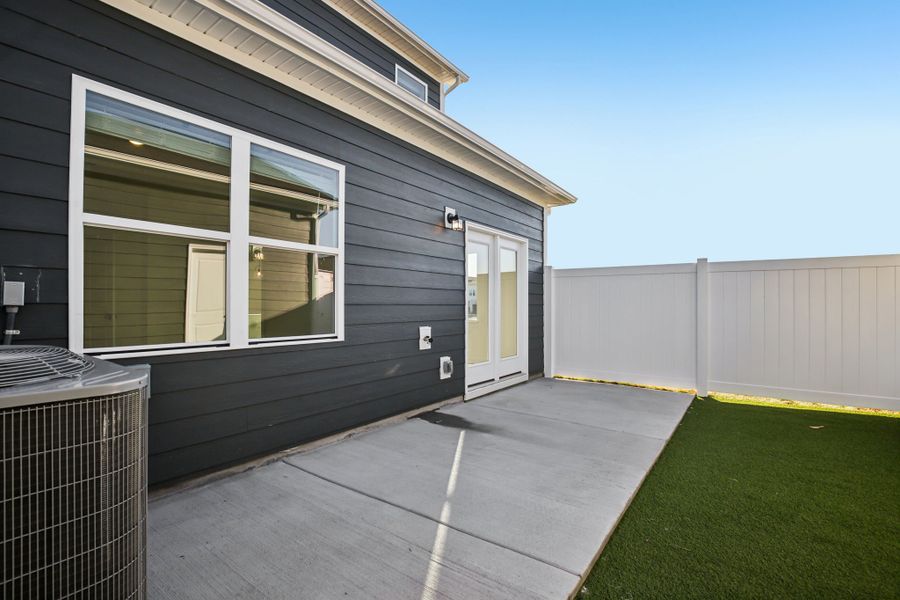 Exterior details and patio area of a home in Greystone - Vista Townhomes, Smyrna (Image 4).