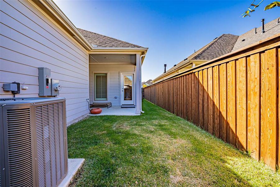 Exterior details and patio area of a home in Walsh Townhomes, Aledo (Image 17).