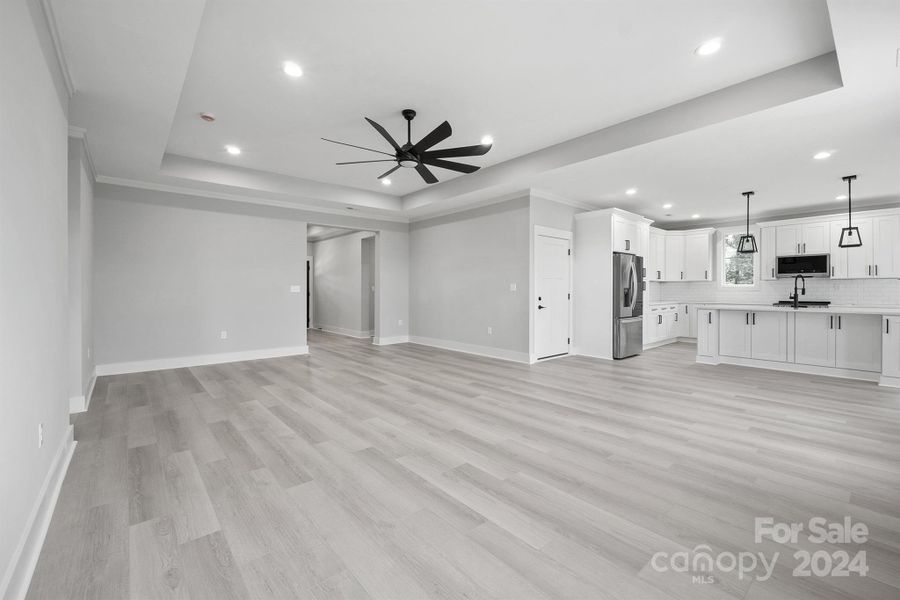 Large living room with view of kitchen showing the open floor plan