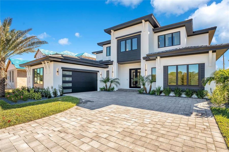 Front exterior of a new home in , Orlando, FL, highlighting curb appeal (Image 28).