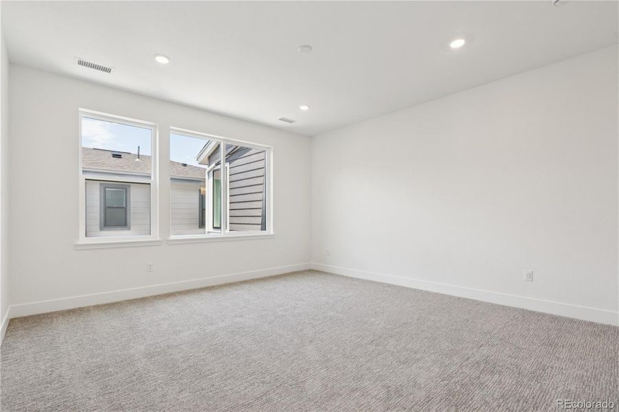 Spacious, unfurnished interior of a new home in Storytellers at Lyric, Lone Tree (Image 25).