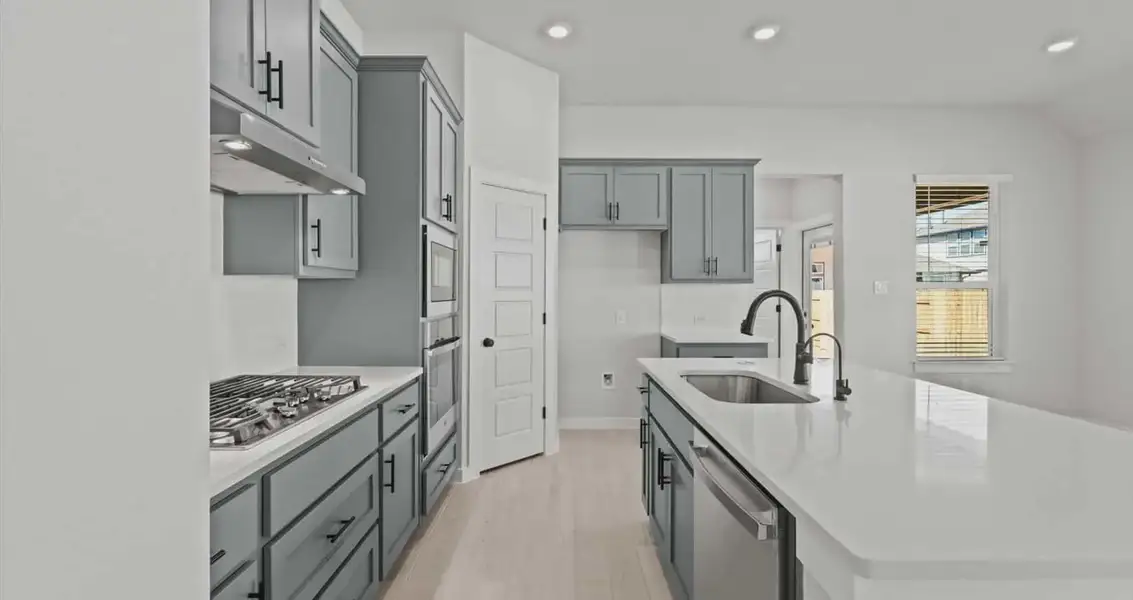 Representative furnished interior of a home built from the Avril by Chesmar Homes in Trace, New Caney (Image 5).