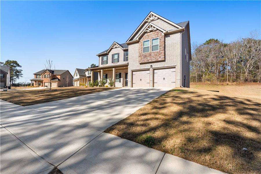 Front exterior of a new home in , Covington, GA, highlighting curb appeal (Image 22). Front exterior of a new home in , Covington, GA, highlighting curb appeal (Image 22).