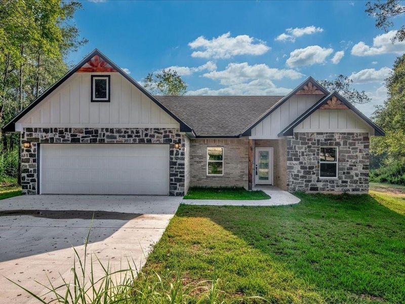 Front exterior of a new home in , Lufkin, TX, highlighting curb appeal (Image 1).