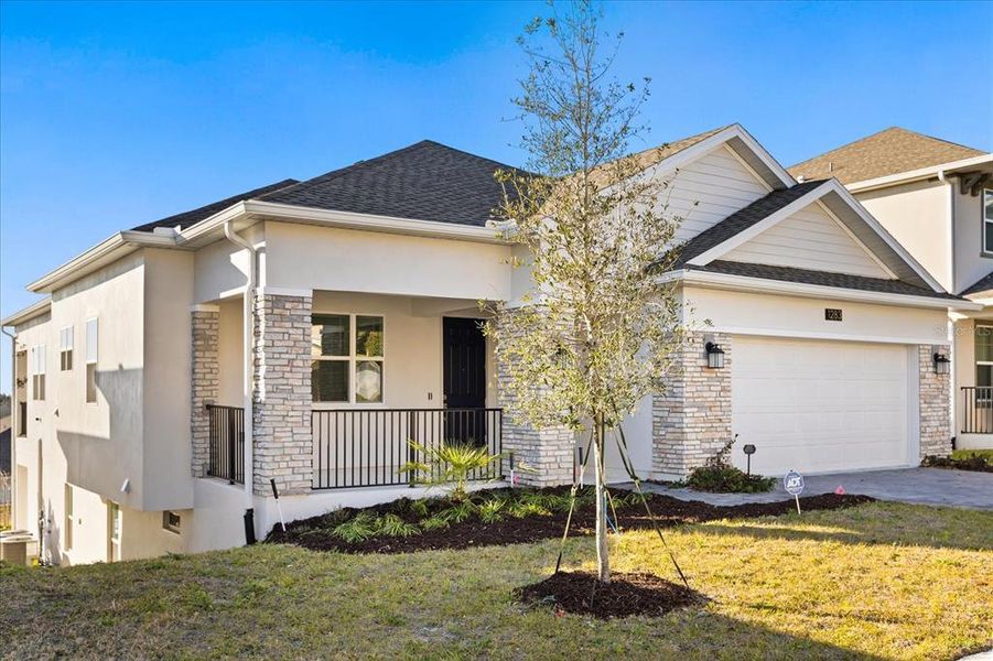 Front exterior of a new home in Dora Parc, Mount Dora, FL, highlighting curb appeal (Image 31).