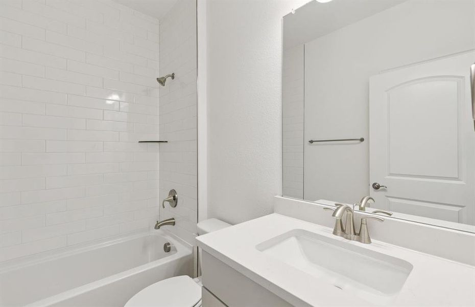 Easily accessible secondary bath on first floor  *Real home pictured