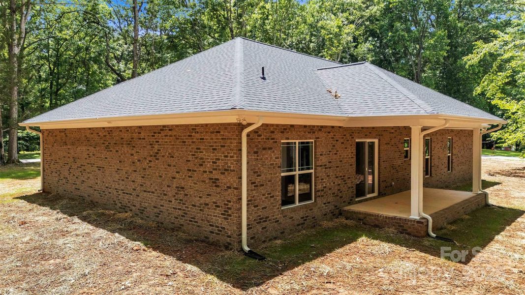 Front exterior of a new home in , Mocksville, NC, highlighting curb appeal (Image 19).