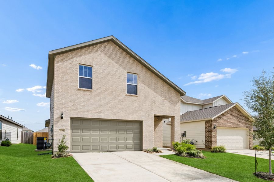 Front exterior of a new home in Magnolia Springs, Montgomery, TX, highlighting curb appeal (Image 2). Front exterior of a new home in Magnolia Springs, Montgomery, TX, highlighting curb appeal (Image 2).