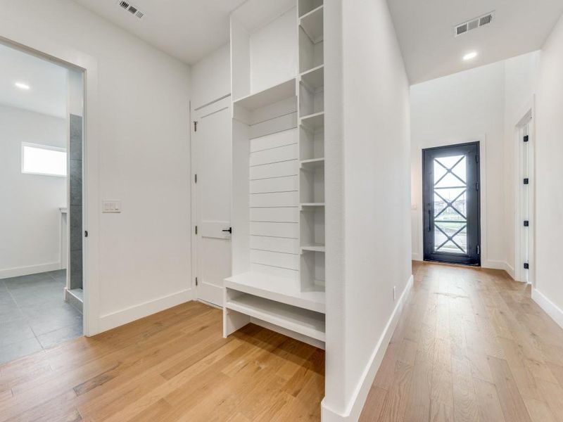 Mudroom featuring plenty of natural light and light hardwood / wood-style flooring