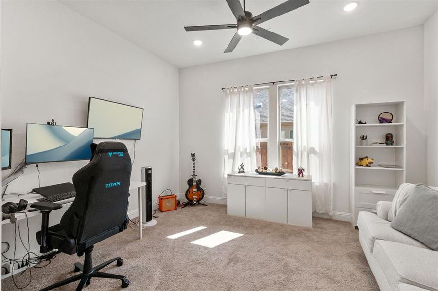 Carpeted home office with recessed lighting and a ceiling fan