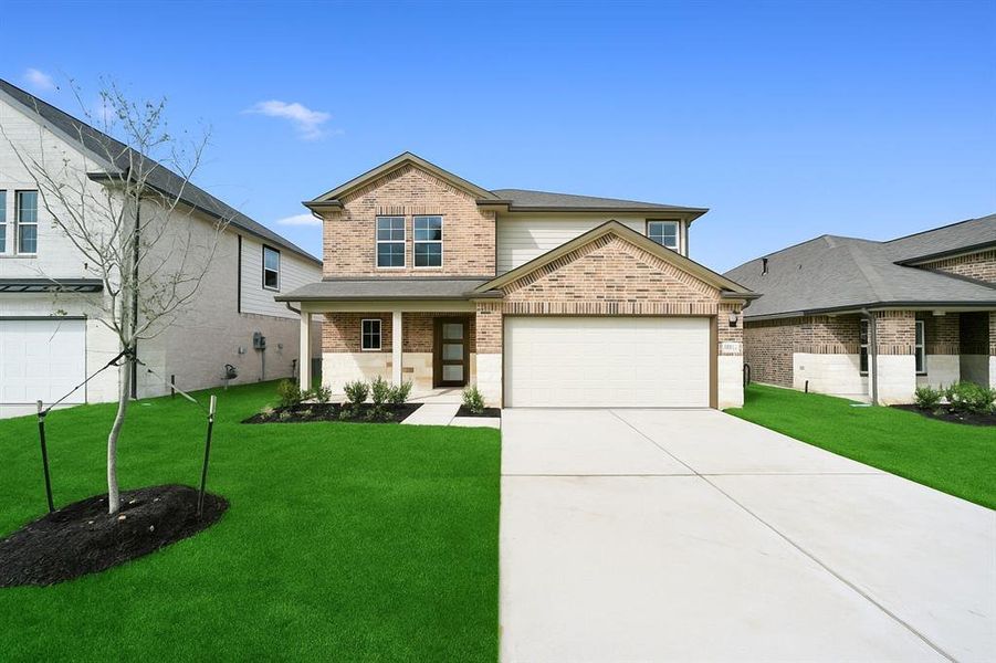 Front exterior of a new home in Windmill Estates, Magnolia, TX, highlighting curb appeal (Image 55).