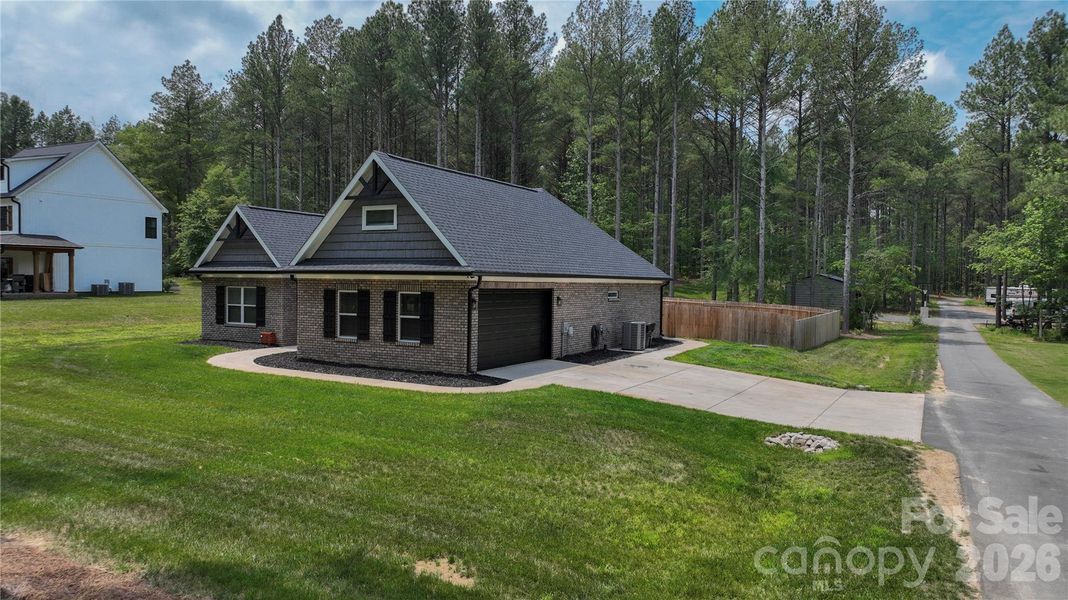 Front exterior of a new home in , Marshville, NC, highlighting curb appeal (Image 21).