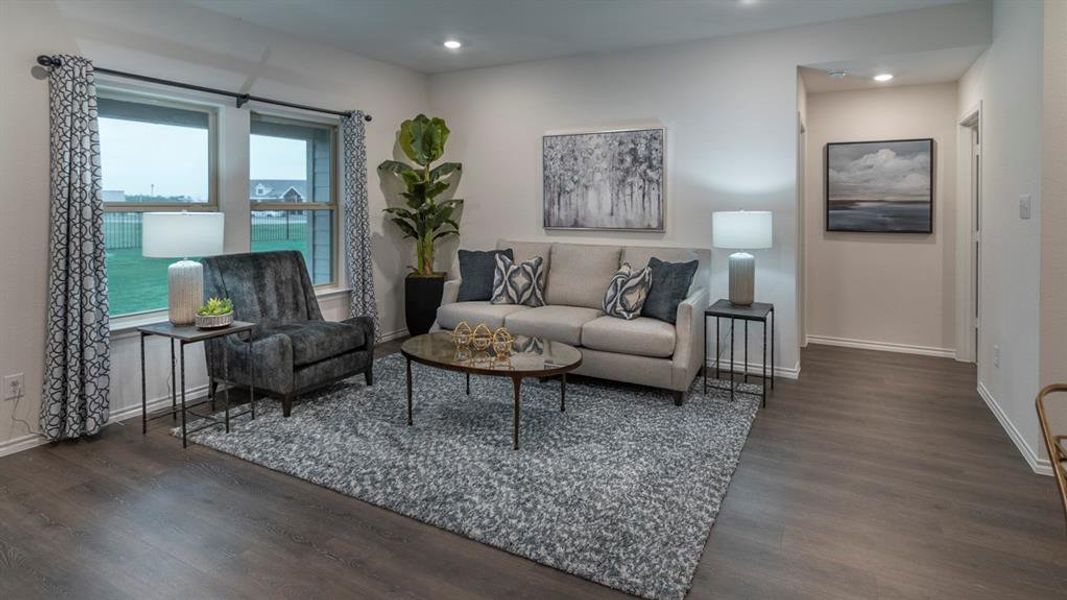 Living area featuring dark wood-style floors and recessed lighting