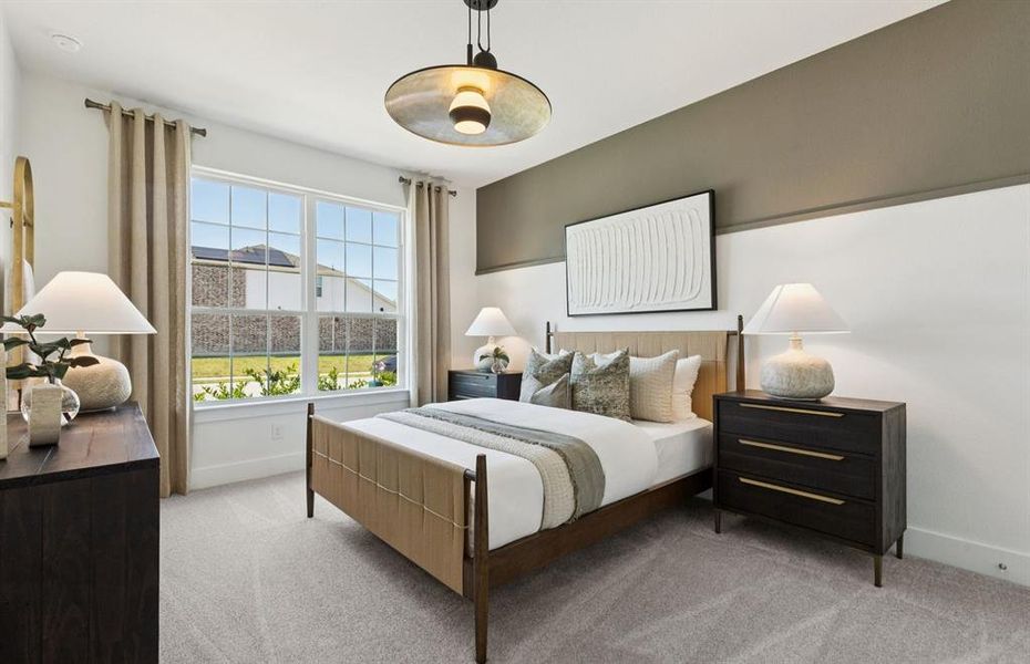 Spacious secondary bedroom with large windows *Model Representation*