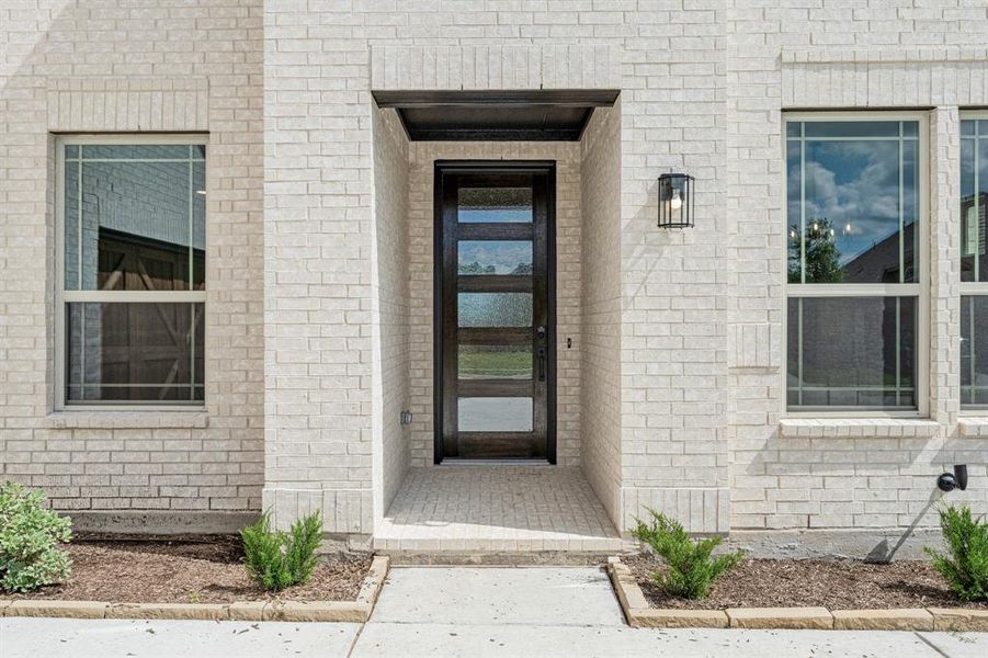 Front exterior of a new home in The Oaks, Red Oak, TX, highlighting curb appeal (Image 2). Front exterior of a new home in The Oaks, Red Oak, TX, highlighting curb appeal (Image 2).