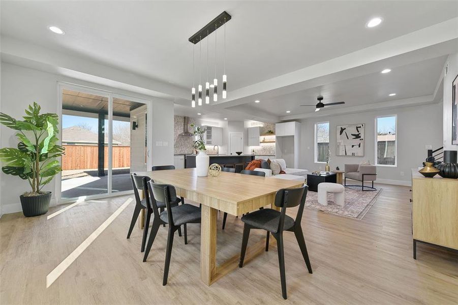 Dining space featuring ceiling fan and light hardwood / wood-style flooring