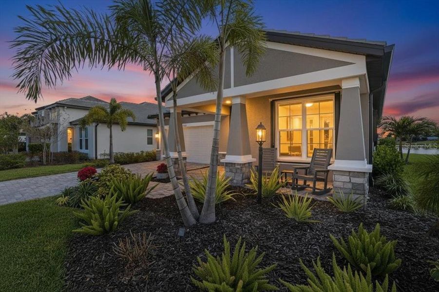 Exterior details and patio area of a home in Cypress Glen at River Wilderness, Parrish (Image 25).
