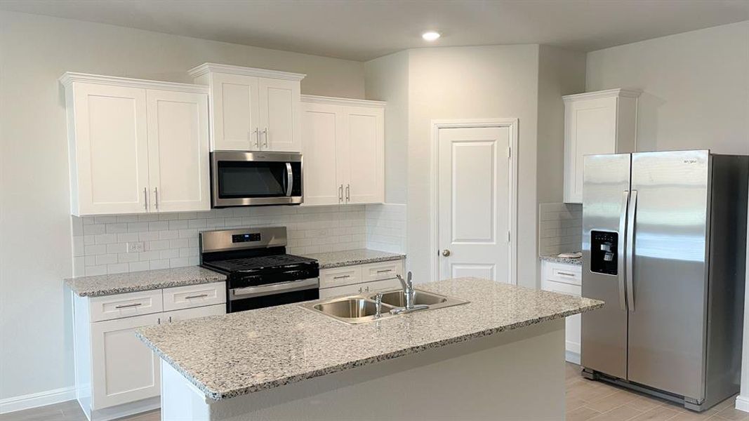 Kitchen - All Home and community information, including pricing, included features, terms, availability and amenities, are subject to change at any time without notice or obligation. All Drawings, pictures, photographs, video, square footages, floor plans, elevations, features, colors and sizes are approximate for illustration purposes only and will vary from the homes as built.