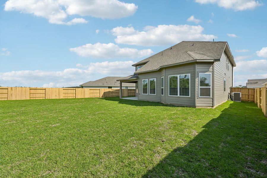 Exterior details and patio area of a home in Riviera Pines - Classic Series, Huffman (Image 31).