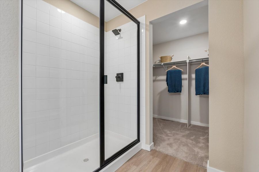 A bathroom with a glass shower. A bathroom with a glass shower.