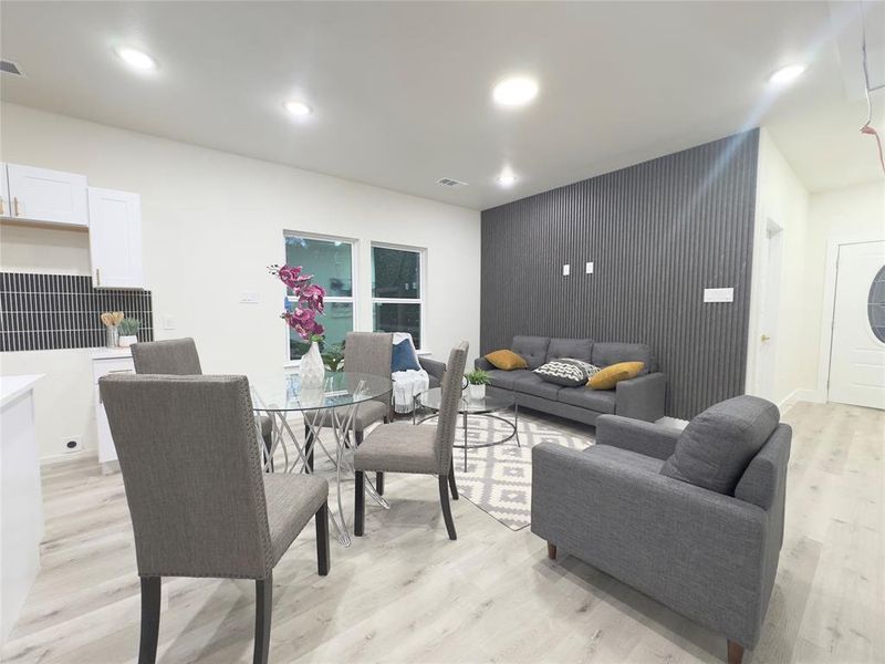 Living room with light hardwood / wood-style flooring