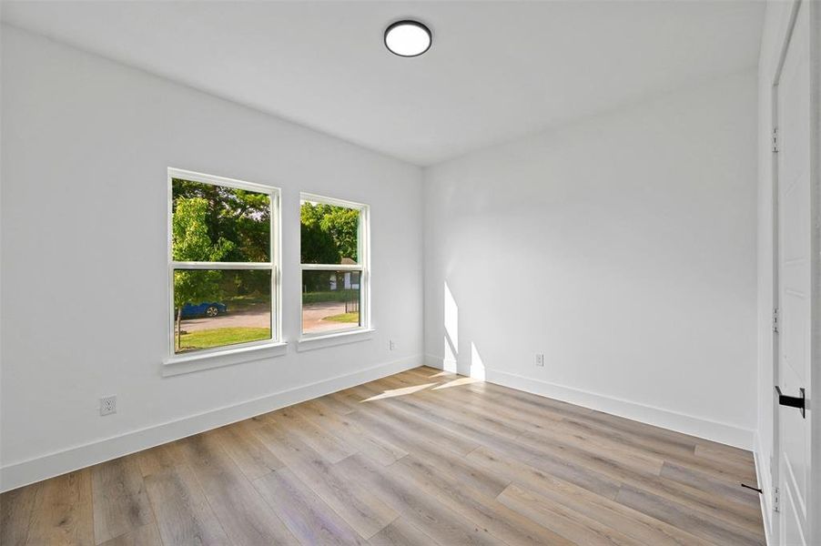 Spare room featuring light wood-type flooring