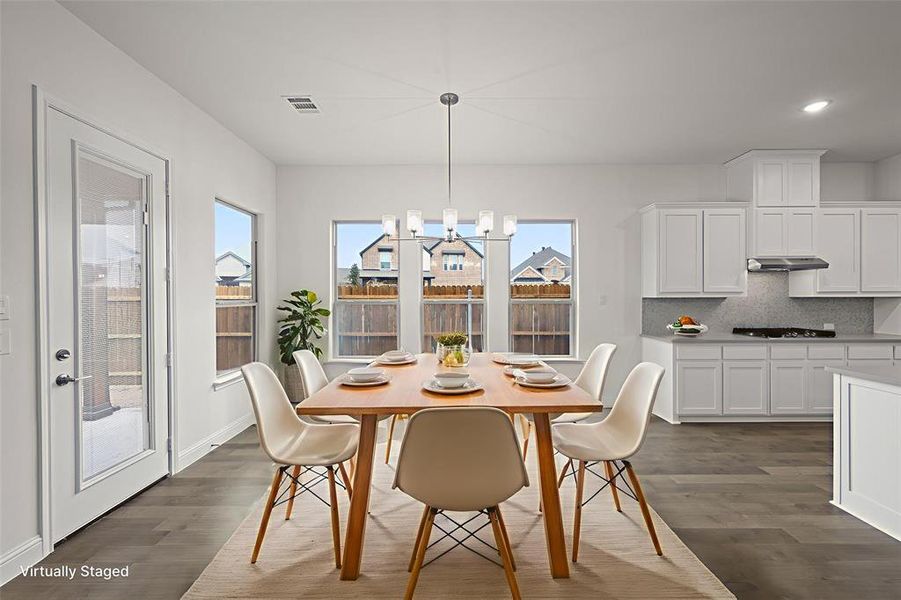 Dining space with dark wood-style floors, recessed lighting, and baseboards Dining space with dark wood-style floors, recessed lighting, and baseboards